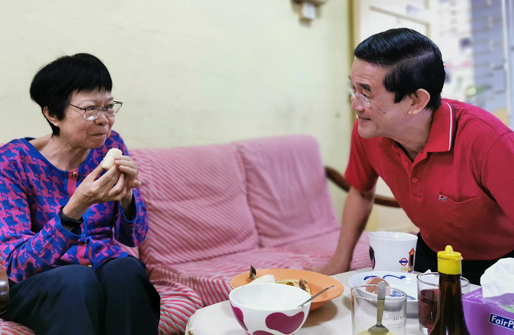 Colin tries to get Joyce, who has dementia, to smile